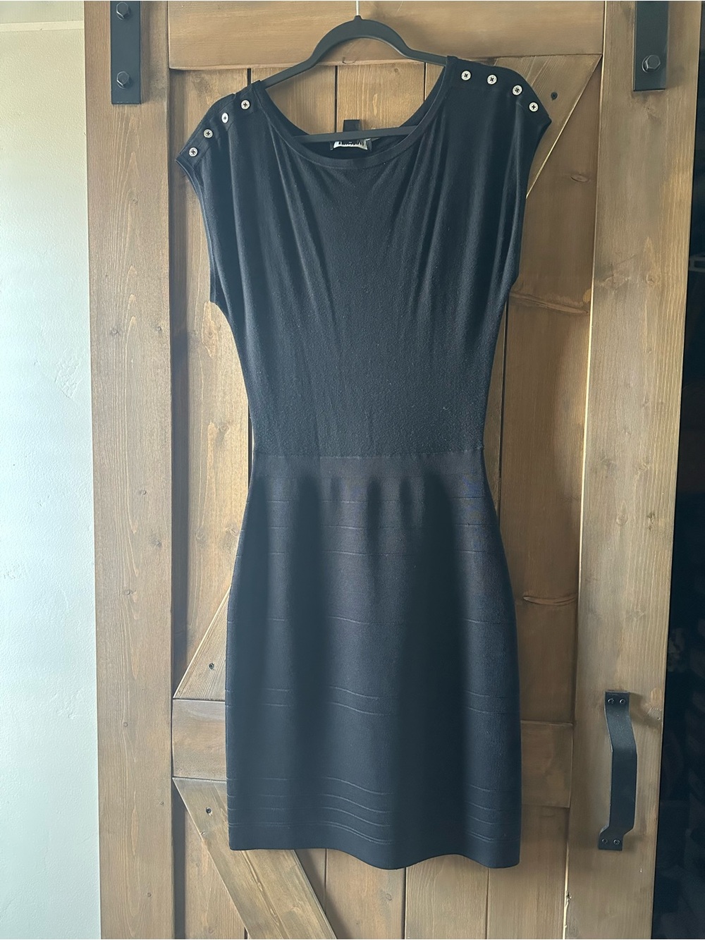 Classic Black Cap-Sleeve Dress with Shoulder Buttons.